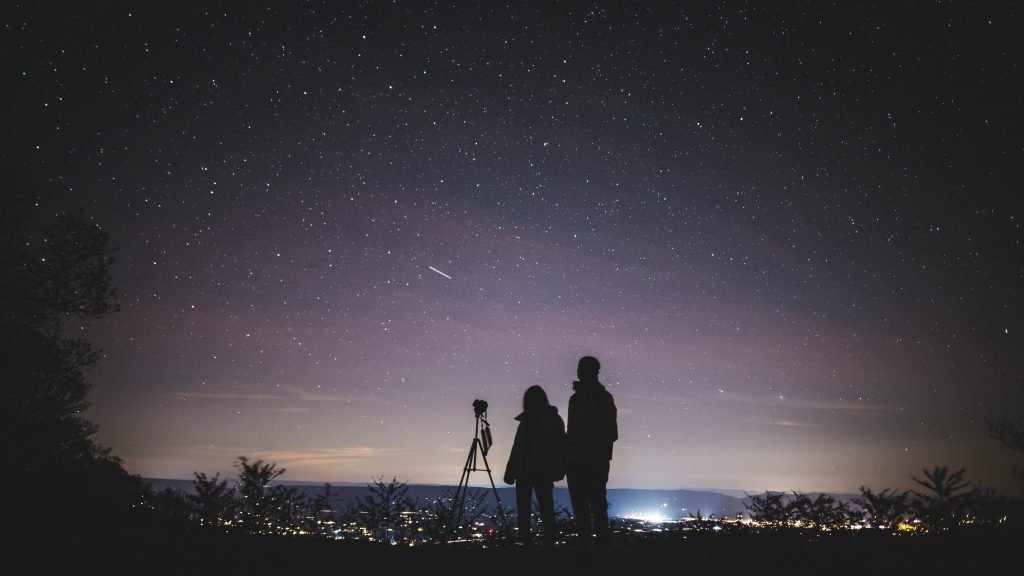 couple looking at night sky